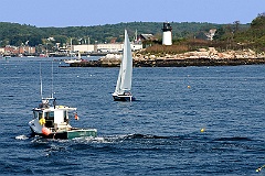 Two Boats Pass Ten Pound Island Light in Gloucester